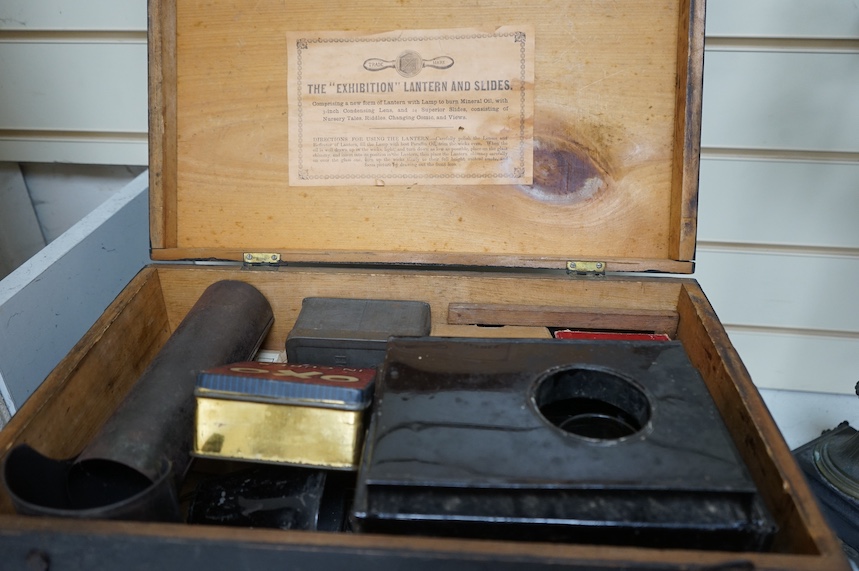 An Exhibition magic lantern and slides, cased, 44cm wide. Condition - commensurate with age and use